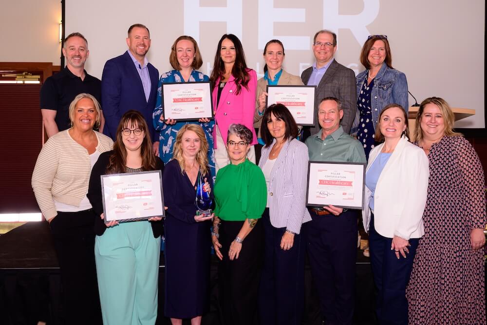 A group of Sego Leadership graduates holding certificates A group of Sego Leadership graduates holding certificates