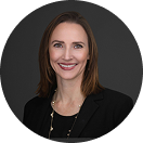 Smiling woman with dark hair in a black blazer Smiling woman with dark hair in a black blazer